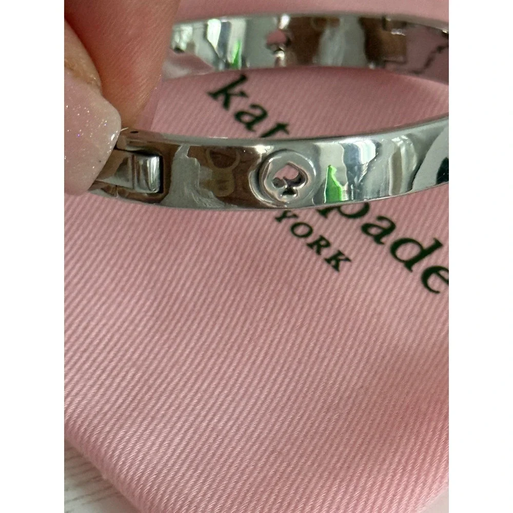 Kate Spade New York Silver Tone Spade Logo Hinged Bangle Bracelet with Dust Bag
